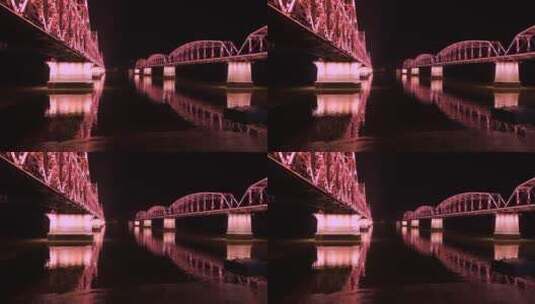 辽宁丹东鸭绿江铁桥夜景灯光倒影水面高清在线视频素材下载