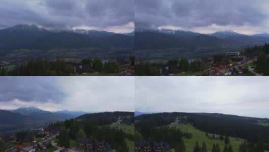 从Gubalowka山脉拍摄的Tatra山脉下Zakopane镇的鸟瞰图高清在线视频素材下载