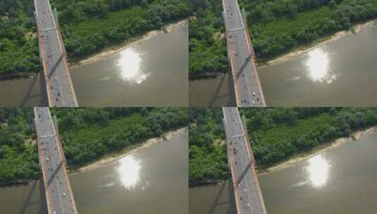 用ci从大河上的柏油路混凝土桥或高速公路的无人机俯视图高清在线视频素材下载