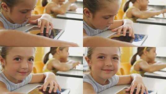 女孩在课堂上使用数字平板电脑高清在线视频素材下载