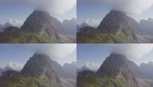 无人机拍摄的郁郁葱葱的绿山，雾清晰地出现在塞塞达山顶高清在线视频素材下载