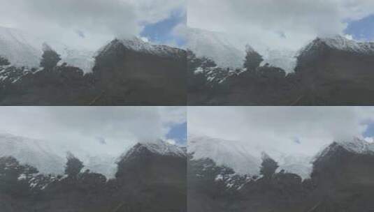 航拍风雪中的西藏山南卡若拉冰川高清在线视频素材下载