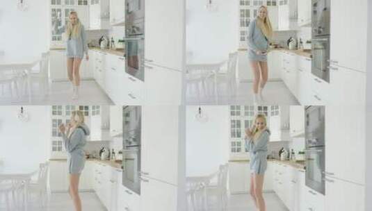 女孩在厨房跳舞高清在线视频素材下载