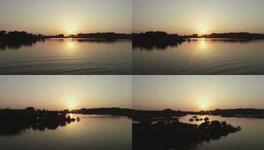 航拍水面夕阳高清在线视频素材下载