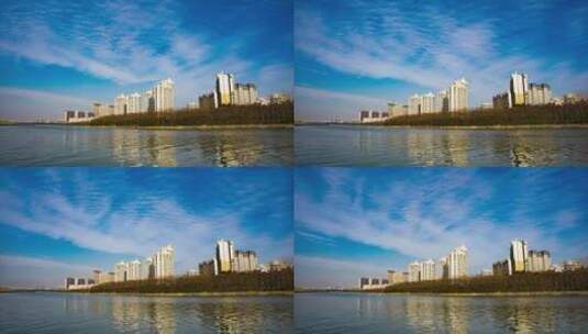 城市江边建筑蓝天白云大气延时摄影4K高清在线视频素材下载
