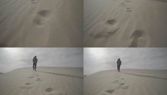 沙漠上行走脚印摇到人背影壮阔升格高清在线视频素材下载