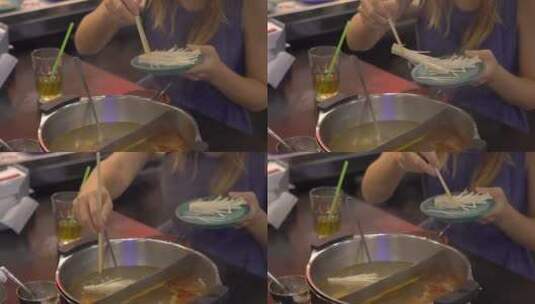 在煮火锅的女孩高清在线视频素材下载