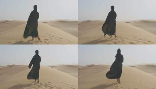 穆斯林在沙漠行走的背影高清在线视频素材下载