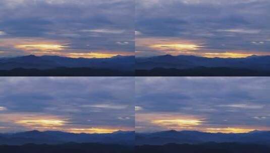 日落时，金色阳光透过云层打在山川大地上高清在线视频素材下载