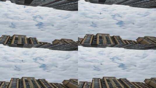 飞机飞过建筑上空高清在线视频素材下载