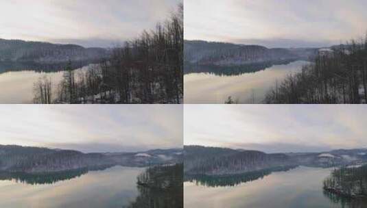 日落时平静的冬季湖泊倒影的照片高清在线视频素材下载
