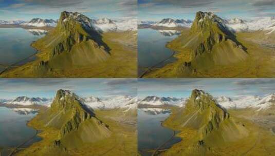 白雪覆盖的山峰和阳光照射的地形的无人机视高清在线视频素材下载