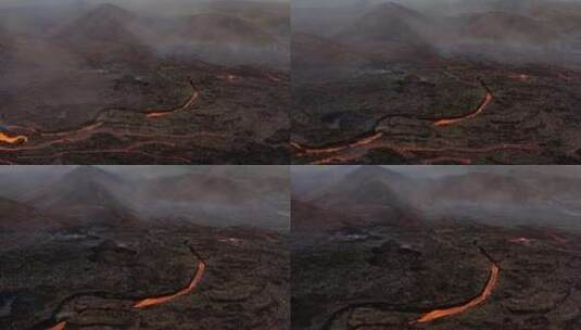 火山喷发期间岩石景观上的熔岩流——无人机高清在线视频素材下载