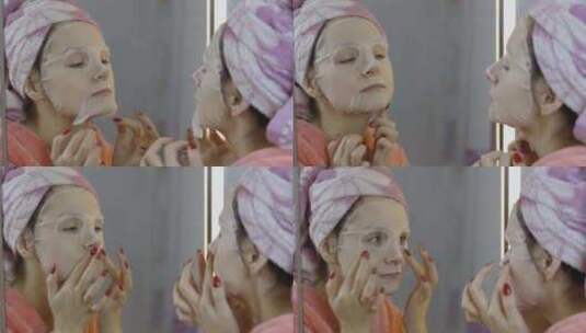 浴室里敷化妆品面膜的女人。护肤品水疗中心高清在线视频素材下载
