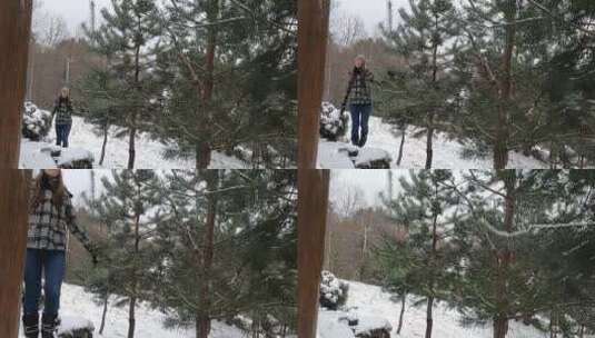 下雪天在山上散步的女人高清在线视频素材下载