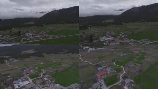西藏林芝地区鲁朗小镇雪景高空航拍高清在线视频素材下载
