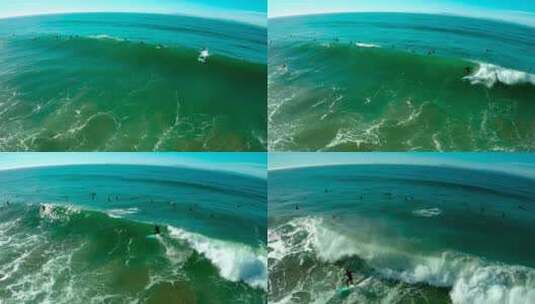 无人机航拍南加州海滩的冲浪运动员高清在线视频素材下载