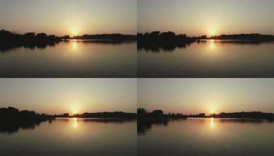 航拍水面夕阳高清在线视频素材下载