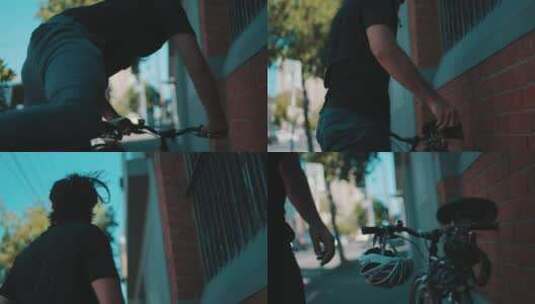 一个骑自行车的人把自行车停在街上高清在线视频素材下载