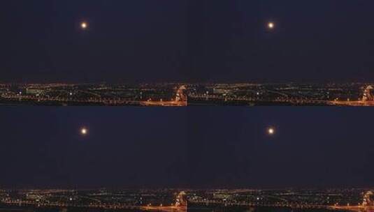 城市夜晚悬挂天空的月亮高清在线视频素材下载