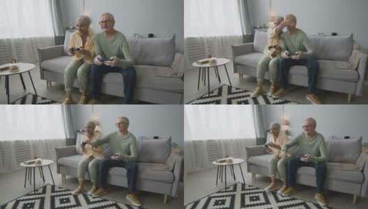 老年夫妻坐在沙发上打游戏高清在线视频素材下载