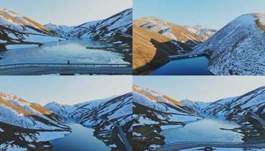 夕阳下大海草山结冰湖面小桥行人航拍高清在线视频素材下载