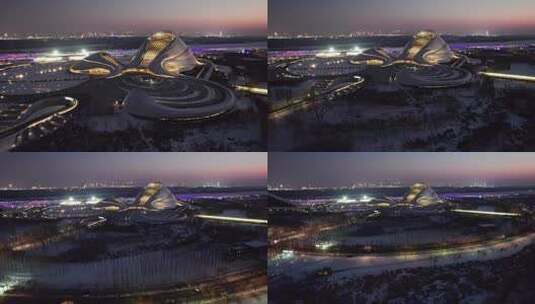 中国哈尔滨大剧院夜景航拍高清在线视频素材下载