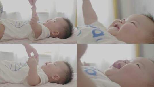 亚洲婴儿笑容牵手高清在线视频素材下载