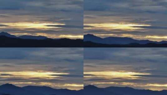 夕阳时的山川大地，一架飞机从天空飞过高清在线视频素材下载