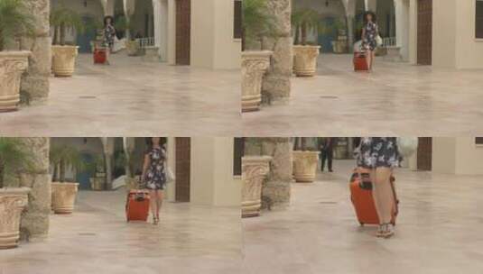 美丽女性度假抵达异国城市，提着行李去酒店高清在线视频素材下载