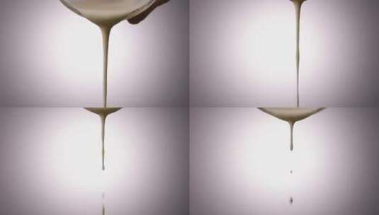 白色面粉糊状液体从高空慢动作掉落高清在线视频素材下载