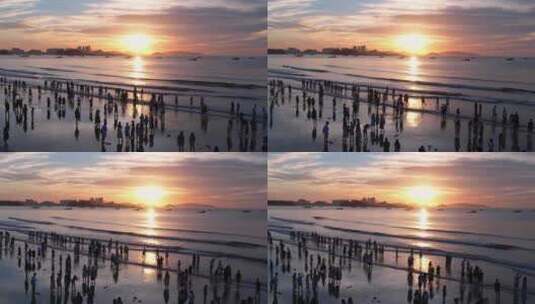 福建东山岛金銮湾海边游客看日出航拍高清在线视频素材下载