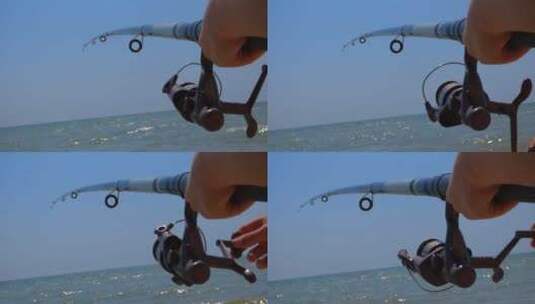 特写一个人钓鱼的鱼竿高清在线视频素材下载
