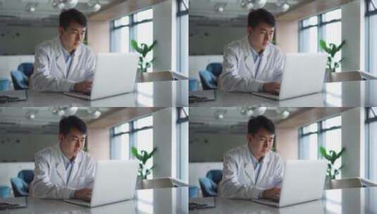 年轻医学科研人员办公室使用笔记本电脑高清在线视频素材下载
