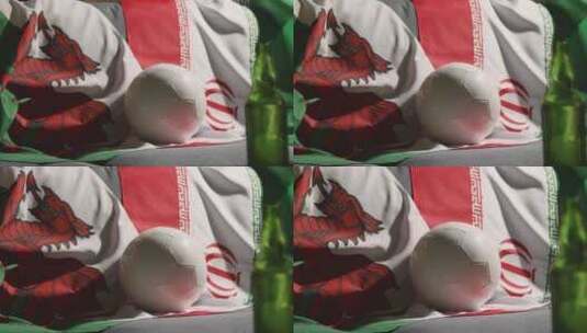 沙发上的威尔士和伊朗国旗和足球高清在线视频素材下载