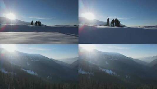 无人机航拍 正在雪山拍摄冬天森林美景的人高清在线视频素材下载