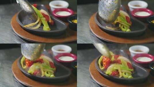 用勺子把煮熟的蔬菜放在盘子里高清在线视频素材下载