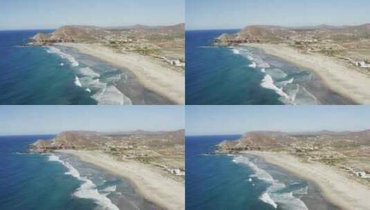 洛斯塞里托斯海滩水波撞击山上沙滩的广角慢动作镜头高清在线视频素材下载