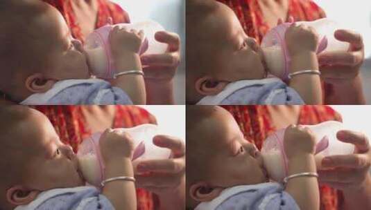 中国宝宝用奶瓶喝奶高清在线视频素材下载