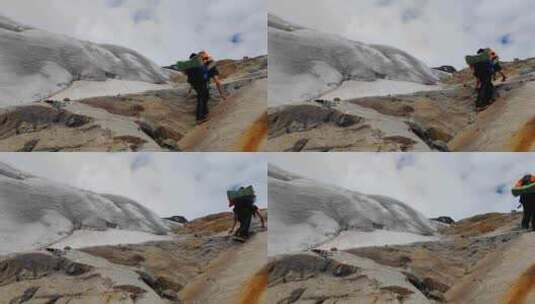 攀登川西沙鲁里山脉加拉本森雪山的登山者高清在线视频素材下载