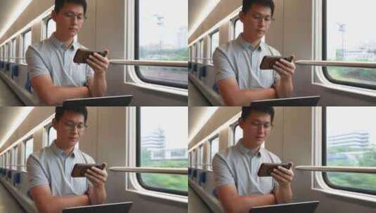 男子出差途中火车上使用笔记本电脑手机办公高清在线视频素材下载