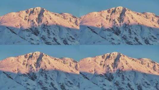 阿勒泰禾木黎明日照金山航拍壮观雪山风景高清在线视频素材下载