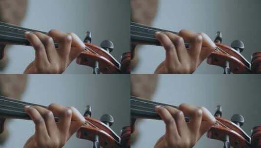 用小提琴演奏和弦的音乐家高清在线视频素材下载