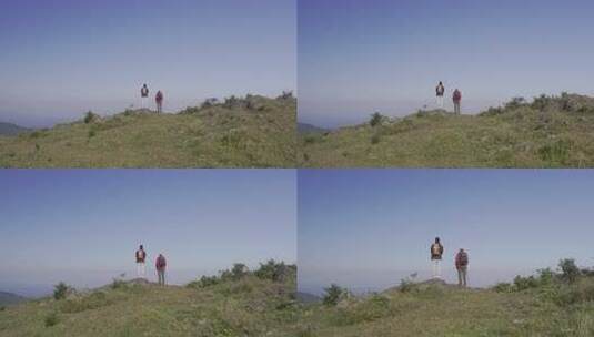 两人山顶眺望远方高清在线视频素材下载
