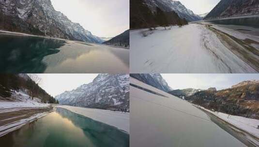 FPV无人机航拍冬日雪景日出河流树林雪山4K高清在线视频素材下载