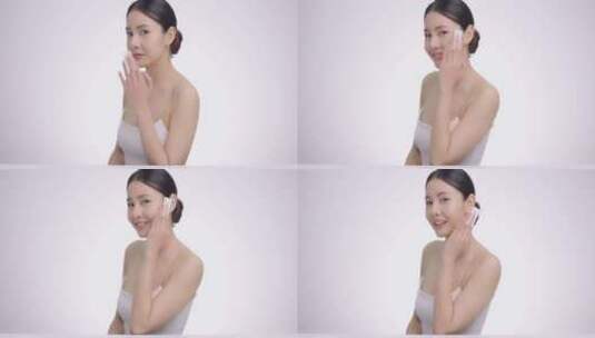 亚洲女人用棉垫轻轻清洁面部高清在线视频素材下载