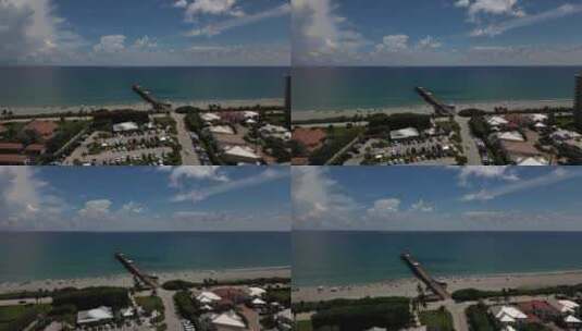 佛罗里达州大西洋上空沿海城镇和扩展码头的无人机镜头。高清在线视频素材下载