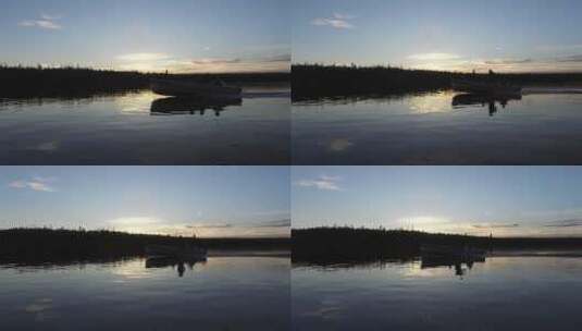 日落时在湖上航行的船高清在线视频素材下载