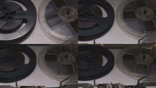 旧模拟卷盘录音机上旋转卷盘的极端特写镜头高清在线视频素材下载