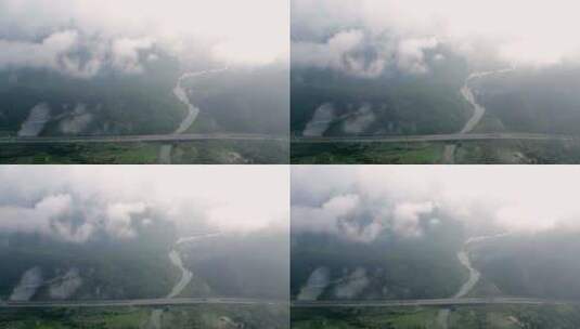 桂林云雾缭绕的山谷中穿行的高速公路高清在线视频素材下载